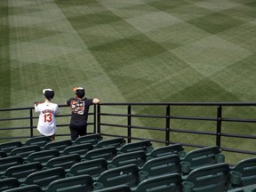 Young Baltimore Orioles fans hang out in the stands before an opening day baseball game between the Orioles and the Minnesota Twins, Thursday, March 29, 2018, in Baltimore.