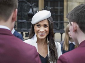 The former actress, who will marry Prince Harry on May 19, appeared to have been swotting up ahead of her first official -engagement with Her Majesty, joining in confidently with the National -Anthem to pay respect to her future grandmother-in-law and her new British home.