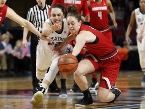 Maine's Blanca Millan, left, and Hartford's Darby Lee battle for the ball in the first half in the America East Conference women's basketball championship, Friday, March 9, 2018, in Bangor, Maine.