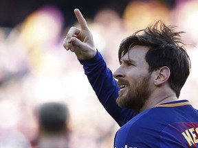 FC Barcelona's Lionel Messi celebrates after scoring during the Spanish La Liga soccer match between FC Barcelona and Athletic Bilbao at the Camp Nou stadium in Barcelona, Spain, Sunday, March 18, 2018.