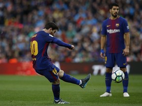 FC Barcelona's Lionel Messi kicks the ball to score during the Spanish La Liga soccer match between FC Barcelona and Atletico Madrid at the Camp Nou stadium in Barcelona, Spain, Sunday, March 4, 2018.