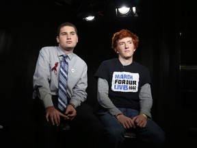 FILE - In this March 19, 2018, file photo, Marjory Stoneman Douglas High School students Alex Wind and Ryan Deitsch, right, discuss the upcoming marches in Washington and elsewhere. The movement is calling for gun regulations during an interview in New York. In the wake of a Valentine's Day shooting that killed 17, a handful of Parkland teenagers are on the cusp of pulling off what could be one of the largest marches in history with nearly 1 million expected in DC and more than 800 sister marches planned across every continent.