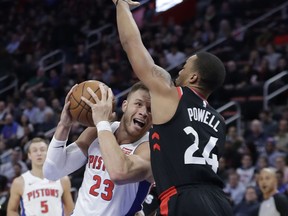 Detroit Pistons forward Blake Griffin (23) looks to shoot as Toronto Raptors forward Norman Powell defends during the first half of an NBA basketball game Wednesday, March 7, 2018, in Detroit.