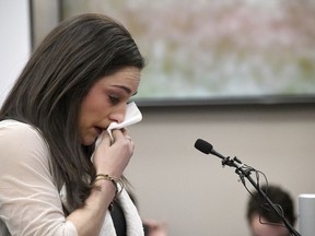 FILE - In a Jan. 19, 2018 file photo, Olympic gold medalist Jordyn Wieber cries as she gives her victim impact statement in Lansing, Mich., during the fourth day of sentencing for former sports doctor Larry Nassar, who pled guilty to multiple counts of sexual assault. Bipartisan legislation in Michigan that would help victims of Nassar's sexual abuse move forward with lawsuits was in limbo Wednesday, March 14, amid pushback from universities, the Catholic Church and others.