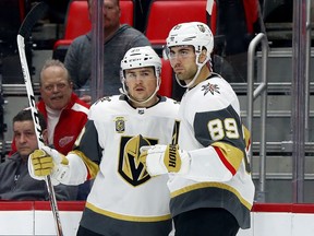 Vegas Golden Knights' Alex Tuch (89) celebrates his goal against the Detroit Red Wings with Ryan Carpenter during the first period of an NHL hockey game Thursday, March 8, 2018, in Detroit.