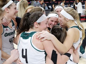 Green Bay players celebrate beating Wright State 62-44 after an NCAA college basketball game in the Horizon League Conference tournament championship in Detroit, Tuesday, March 6, 2018.