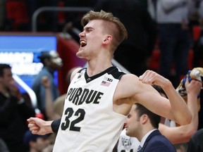 Purdue forward Matt Haarms (32) celebrates a win over Butler in an NCAA men's college basketball tournament second-round game in Detroit, Sunday, March 18, 2018.