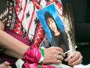 Bella Bresse holds a photo of her murdered daughter, Evangeline Billy, at the National Inquiry into Missing and Murdered Indigenous Women and Girls, in Whitehorse on May 31, 2017.
