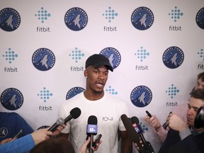 Injured Minnesota Timberwolves guard Jimmy Butler speaks to the media for the first time since having surgery before an NBA basketball game against the Houston Rockets, Sunday, March 18, 2018 in Minneapolis. Butler could return to the court for the Timberwolves before the end of the regular season, if he stays on track with his rehabilitation from knee surgery.