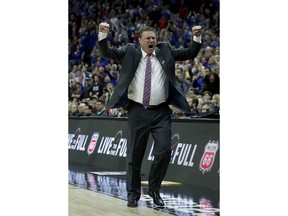Kansas head coach Bill Self celebrates after winning the NCAA college basketball championship game against West Virginia in the Big 12 men's tournament Saturday, March 10, 2018, in Kansas City, Mo. Kansas won 81-70.