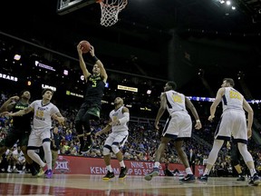 Baylor's Jake Lindsey (3) puts up a shot during the first half of an NCAA college basketball game against West Virginia in the Big 12 men's tournament Thursday, March 8, 2018, in Kansas City, Mo.
