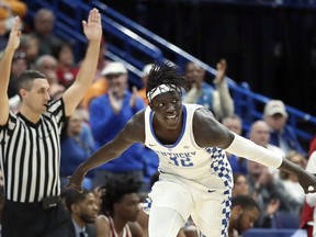 Kentucky's Wenyen Gabriel celebrates after making a 3-point basket during the first half of an NCAA college basketball game against Alabama in the semifinals of the Southeastern Conference tournament Saturday, March 10, 2018, in St. Louis.