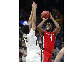Georgia's Yante Maten (1) shoots over Missouri's Jontay Porter during the second half in an NCAA college basketball game at the Southeastern Conference tournament Thursday, March 8, 2018, in St. Louis. Georgia won 62-60.
