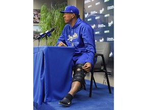 Kansas City Royals catcher Salvador Perez talks Wednesday, March 28, 2018, in Kansas City, Mo., about spraining the medial collateral ligament in his left knee while carrying a suitcase up the stairs of his home Tuesday. Perez will miss up to six weeks.