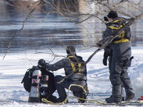 Police divers search the shores of the Riviere des Prairies on Montreal's north shore, Monday, March 19, 2018 for missing 10-year-old boy Ariel Jeffrey Kouskou who disappeared one week ago.