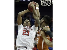 Texas Tech guard Jarrett Culver (23) shoots over Texas guard Kerwin Roach II (12) during the first half of an NCAA college basketball game in quarterfinals of the Big 12 men's tournament in Kansas City, Mo., Thursday, March 8, 2018.