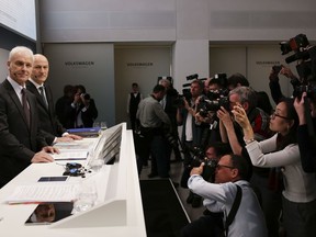 VW group CEO Matthias Mueller, left, and CFO Frank Witter, second from left, arrive for the annual media conference of the Volkswagen group, in Berlin, Germany, Tuesday, March 13, 2018.