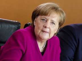 German Chancellor Angela Merkel leads the first regular weekly cabinet meeting of Germany's new government at the chancellery in Berlin, Wednesday, March 21, 2018.