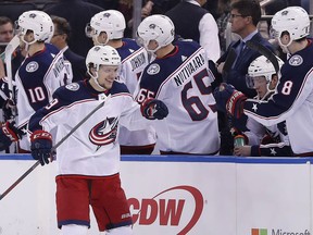 Columbus Blue Jackets left wing Artemi Panarin (9) is congratulated by teammates after scoring a goal against the New York Rangers during the second period of an NHL hockey game Tuesday, March 20, 2018, in New York.