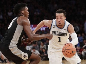 Villanova's Jalen Brunson (1) drives past Providence's Rodney Bullock (5) during the first half of an NCAA college basketball game in the Big East men's tournament final Saturday, March 10, 2018, in New York.