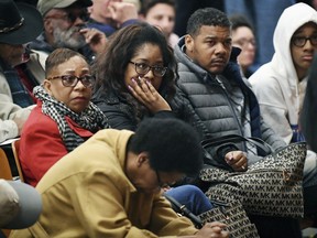 In this Wednesday, March 7, 2018 photo, a large crowd attend the Asheville Citizens Police Action Committee meeting at the Dr. Wesley Grant Sr. Southside Center in Asheville, N.C. The FBI is probing the Aug. 25, 2017 beating of a black man by a white police officer as anger mounts about the handling of the case. The FBI's involvement was confirmed by state law enforcement officials on Wednesday night after the start of the community meeting on the topic.  The officer involved resigned in January.