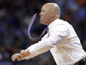Lipscomb head coach Casey Alexander reacts to a call during the first half of a first-round game against North Carolina in the NCAA men's college basketball tournament in Charlotte, N.C., Friday, March 16, 2018.