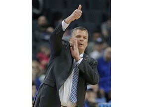 Creighton coach Greg McDermott directs his team against Kansas State during the first half of a first-round game in the NCAA men's college basketball tournament in Charlotte, N.C., Friday, March 16, 2018.