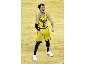 UMBC's Jairus Lyles celebrates the team's 74-54 win over Virginia in a first-round game in the NCAA men's college basketball tournament in Charlotte, N.C., Friday, March 16, 2018.