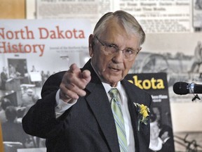 FILE - In this April 30, 2010 file photo, former Governor George Sinner gestures while reminiscing about his years as North Dakota's governor at an event in his honor at the North Dakota Heritage Center at the release of the latest issue of North Dakota History in Bismarck, N.D. Sinner, who led the state during turbulent economic times, has died at age 89. His son, George Sinner Jr., confirmed his death Friday, March 9, 2018.