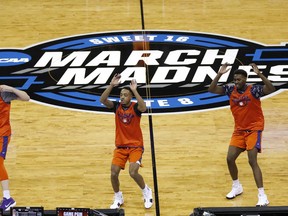 Clemson players run on the court during practice at the NCAA men's college basketball tournament, Thursday, March 22, 2018, in Omaha, Neb. Clemson faces Kansas in a regional semifinal on Friday.