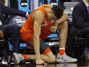 Syracuse's Matthew Moyer is seen on the bench during the second half of a regional semifinal game against Duke in the NCAA men's college basketball tournament Friday, March 23, 2018, in Omaha, Neb.