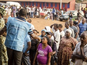 Voters wait in line to cast their ballots during a presidential, elections, outside a polling station in Freetown, Sierra Leone, Wednesday, March 7, 2018. Sierra Leone's voters are choosing a new president Wednesday from among 16 candidates in a race that has sparked debate over dual nationality and eligibility for the country's highest office.