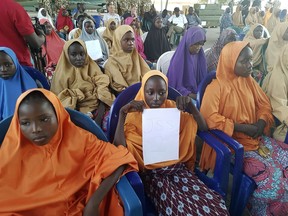 The girls from the Government Girls Science and Technical College Dapchi  who were kidnapped and set free are photographed during a hand over to government officials in Maiduguri, Nigeria, Wednesday March 21, 2018. Witnesses say Boko Haram militants have returned an unknown number of the 110 girls who were abducted from their Nigeria school a month ago.