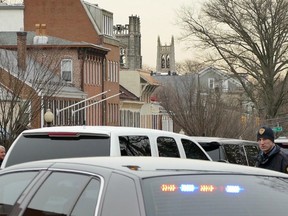 Police surrounded a restaurant across the street from Princeton University's campus during a stand off with an armed man, on Tuesday, March 20, 2018 in Princeton, N.J.  Police say there are "no known hostages" in the Panera Bread, but it's not clear what sparked the standoff that began early this morning.