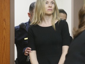 FILE - This Feb. 14, 2013 file photo shows Amy Locane Bovenizer entering the courtroom to be sentenced in Somerville, N.J.  for the 2010 drunk driving accident in Montgomery Township that killed 60-year-old Helene Seeman  The actress, who served about two-and-a-half years of a three-year sentence, must return to court for a second re-sentencing.