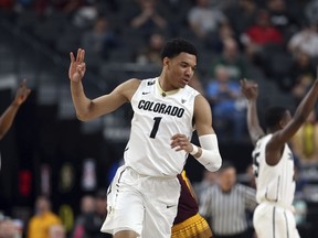 Colorado's Tyler Bey reacts after sinking a three-point shot during the second half of an NCAA college basketball game against Arizona State in the first round of the Pac-12 men's tournament Wednesday, March 7, 2018, in Las Vegas.