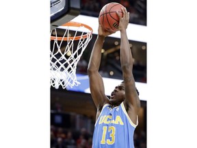 UCLA's Kris Wilkes dunks during the first half of the team's NCAA college basketball game against Arizona in the semifinals of the Pac-12 men's tournament Friday, March 9, 2018, in Las Vegas.