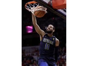 Nevada's Cody Martin dunks during the first half of the team's NCAA college basketball game against UNLV on Wednesday, Feb. 28, 2018, in Las Vegas.
