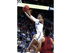 UCLA's Jaylen Hands (4) shoots over Stanford's Dorian Pickens (11) during the first half of an NCAA college basketball game in the quarterfinals of the Pac-12 tournament Thursday, March 8, 2018, in Las Vegas.