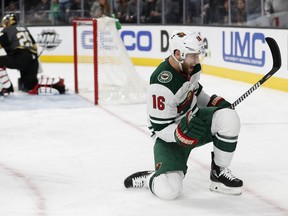 Minnesota Wild left wing Jason Zucker (16) celebrates after scoring against the Vegas Golden Knights during the first period of an NHL hockey game, Friday, March 16, 2018, in Las Vegas.