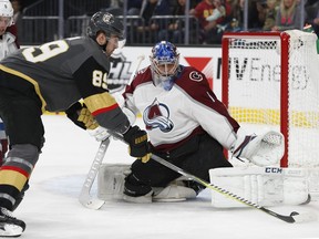 Colorado Avalanche goaltender Semyon Varlamov blocks a shot by Vegas Golden Knights right wing Alex Tuch during the first period of an NHL hockey game, Monday, March 26, 2018, in Las Vegas.