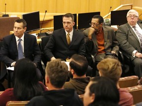 FILE - In this Nov. 28, 2017, file photo, Scott Nielson, left, chairman of the Las Vegas Victims Fund committee, victim advocate Jeff Dion, center, and Steve Rickman, second right, listen as victims and survivors of the Oct. 1 Las Vegas mass shooting give input on the Las Vegas Victims Fund committee's proposed guidelines of how funds should be distributed, in Las Vegas. A $31.5 million victims' fund that started as an online GoFundMe effort plans to pay $275,000 to families of the 58 people killed in the deadliest mass shooting in modern U.S. history. The Las Vegas Victims Fund announced Friday, March 2, 2018, that the maximum $275,000 also will be paid to 10 other people who were paralyzed or suffered permanent brain damage in the shooting.