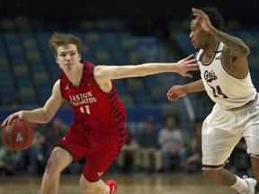 Eastern Washington's Jack Perry (11) drives past Montana's Ahmaad Rorie (14) in the first half of the Big Sky Championship NCAA college basketball game in Reno, Nev., Saturday, March 10, 2018.