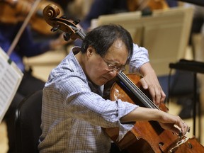 FILE - In this Nov. 20, 2014 file photo, cellist Yo-Yo Ma rehearses Prokofiev's Symphony Concerto for cello and orchestra at Symphony Hall in Boston.  The World-famous cellist  performed a special concert for the California children who authorities said were starved and shackled to their beds by their parents. Corona Mayor Karen Spiegel says Ma performed Friday, March 2, 2018 at the Corona Regional Medical Center.