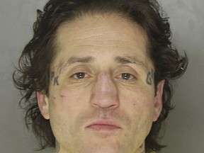 FILE - This undated photo provided by the Pittsburgh Department of Public Safety shows Paul Spadafora of Pittsburgh.  Spadafora has pleaded guilty to resisting arrest and simple assault on police officers who responded to a domestic dispute at his Pittsburgh home in 2016. The 42-year-old boxer was sentenced Thursday, March 22, 2018  to time served and probation. Spadafora also was accused of stabbing his brother and kicking his mother during the dispute, but those charges were dropped.