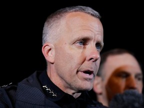 FILE - In this March 21, 2018 file photo, Austin Police Chief Brian Manley briefs the media in the Austin suburb of Round Rock, Texas.  Manley says a "domestic terrorist" set off a series of explosions that killed two people and severely wounded four others in the Texas capital. Manley had previously hesitated to label the bombings domestic terrorism, citing the ongoing investigation. But at a meeting Thursday, March 29  on the police and community response to the bombings, Manley labeled the accused bomber a "domestic terrorist for what he did to us."