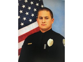 This undated photo provided by Winston-Salem Police Department shows  officer D.E. McGuire of the Winston-Salem Police Department.  Authorities say McGuire has shot and killed a passenger after a traffic stop led to a physical struggle. A Winston-Salem Police Department news release says Officer D.E. McGuire was patrolling late Friday, March 20, 2018,  when he stopped a car containing two men and a woman.(Winston-Salem Police Department via AP)