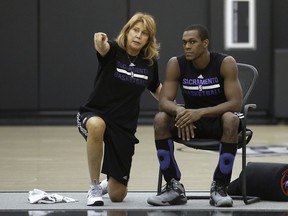 FILE - In this Oct. 26, 2015, file photo, Sacramento Kings assistant coach Nancy Lieberman talks with guard Rajon Rondo during NBA basketball practice in Sacramento, Calif. Lieberman, a Hall of Famer, will coach a team this season in the BIG3, the league announced Wednesday, March 21, 2018. Lieberman, one of women's basketball's star players who has gone on to coach in the NBA, WNBA and NBA Development League, will lead Power. She replaces Clyde Drexler, who recently accepted a job as commissioner of the 3-on-3 league of former NBA players.