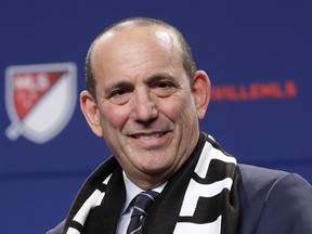 FILE - In this Dec. 20, 2017, file photo, Major League Soccer commissioner Don Garber smiles during a press conference where it was announced that Nashville was awarded an MLS franchise, in Nashville, Tenn. Major League Soccer and Liga MX have joined in a long-term partnership that will launch later this year when reigning MLS Cup champion Toronto hosts a team from Mexico's top league. The match, dubbed the Campeones Cup, is set for Sept. 19 at BMO Field. The partnership announced Tuesday, March 13, 2018, will go beyond that single game to include youth competitions, future All-Star games and other events and initiatives. "We and Liga MX have an opportunity to do something that's really unprecedented in North America," Garber said.