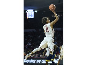 FILE - In this Feb. 5, 2018, file photo, Oklahoma's Trae Young goes up for a shot in the second half of an NCAA college basketball game against West Virginia in Norman, Okla. Oklahoma star freshman Trae Young is leaving for the NBA after a standout season. The 6-foot-2 guard averaged 27.4 points and 8.7 assists this season, and many projections have him going early in the first round. He posted the reasons for his decision on ESPN early Tuesday, March 20, 2018, saying he was ready to put in the work needed to play in the NBA.